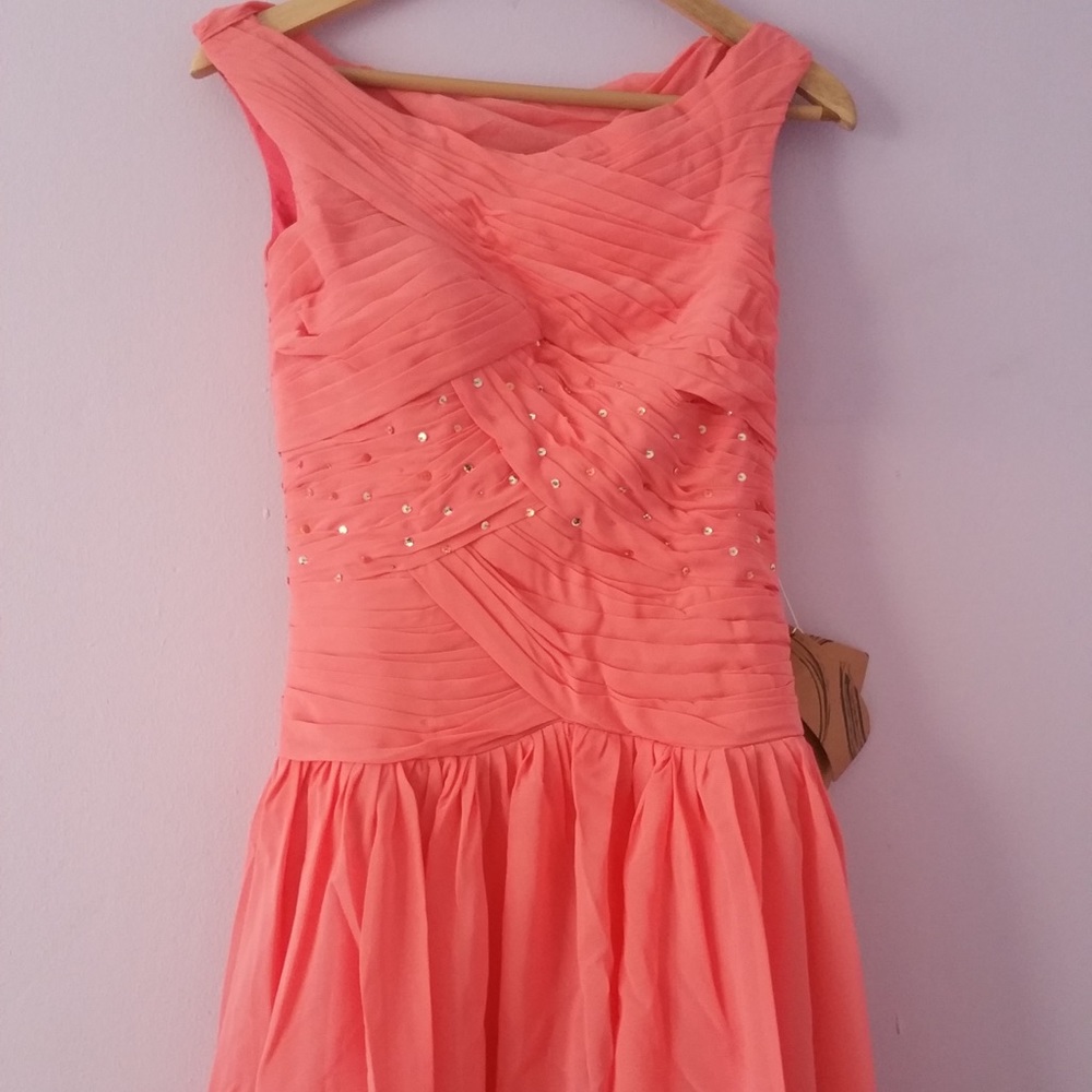 Melon dress with sequined chiffon overlay.